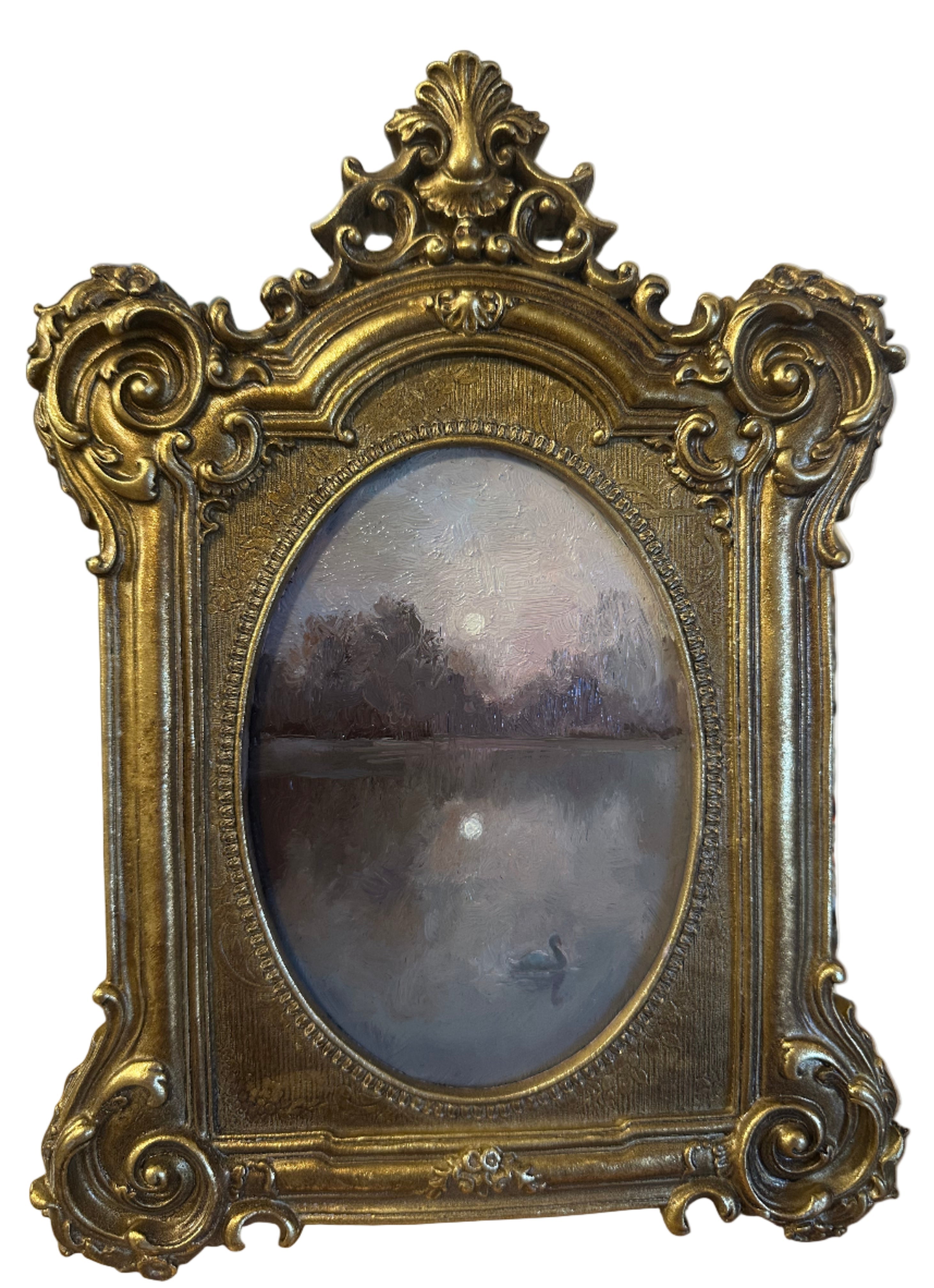 Decorative gold frame with intricate designs on a blurred background